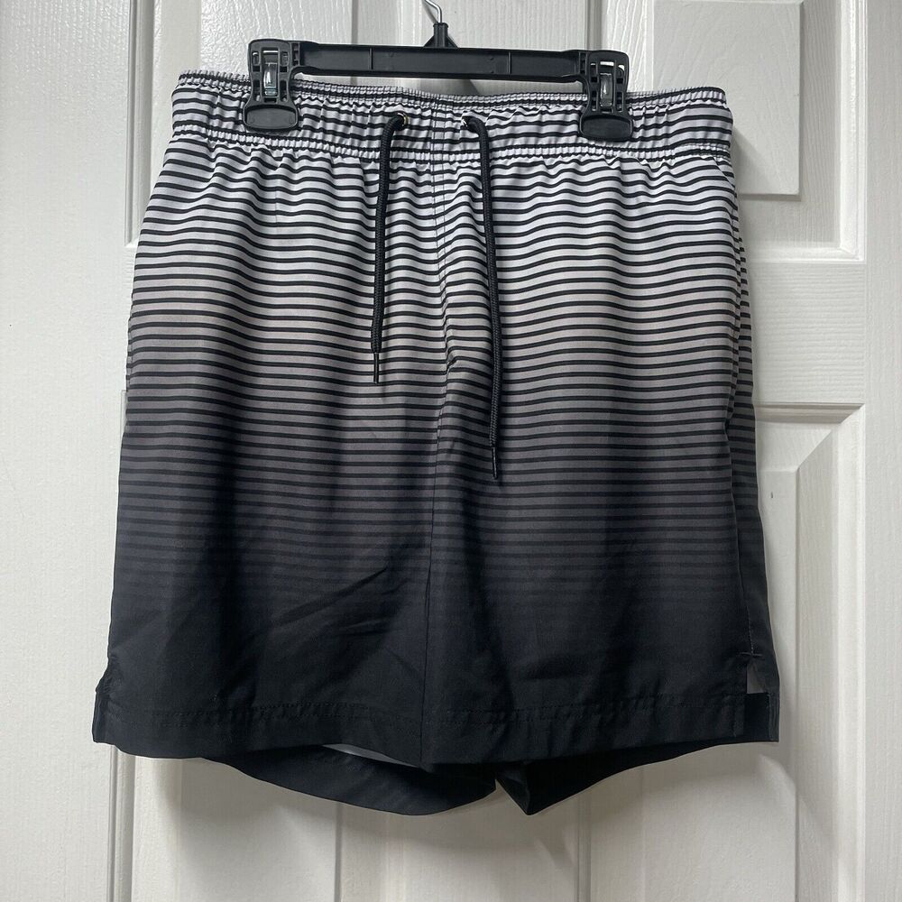 Men’s swim short small (28-30) used has Some Wear on the back. Black Gray White